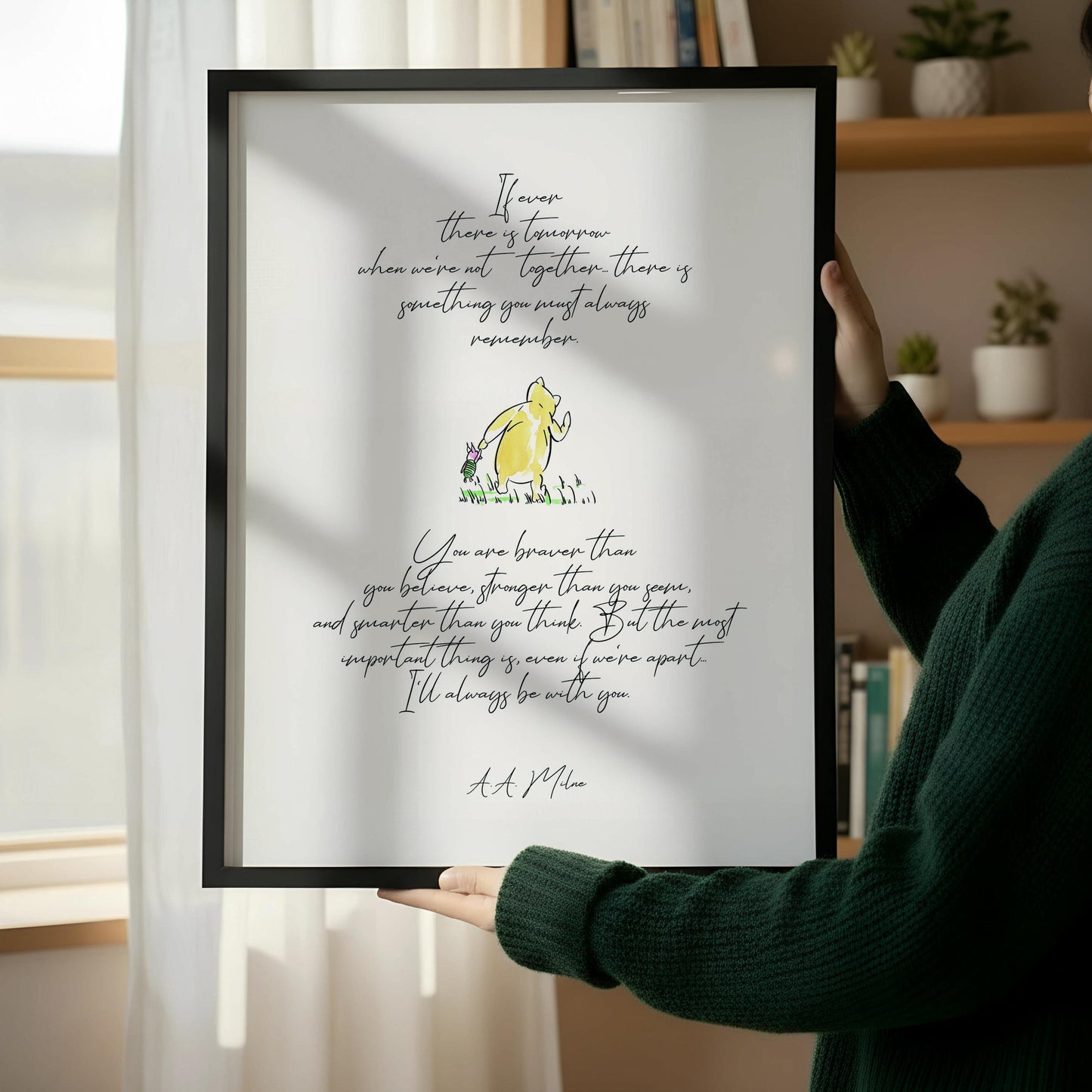 a wooden chair with a book resting on it, positioned next to a framed quote on a white wall.