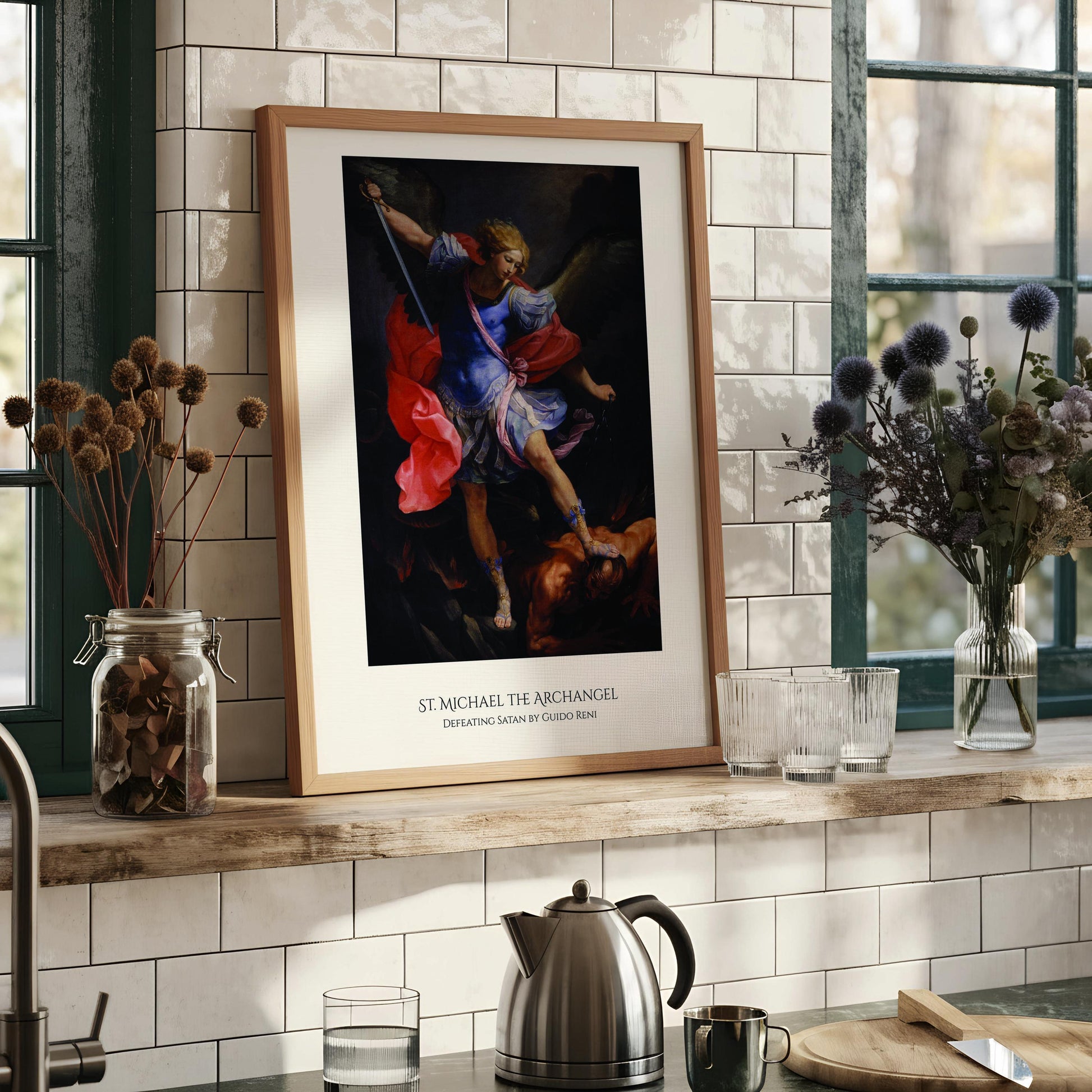 The image is a framed painting depicting St. Michael the Archangel, with the text "ST. MICHAEL THE ARCHANGEL" below the artwork.
