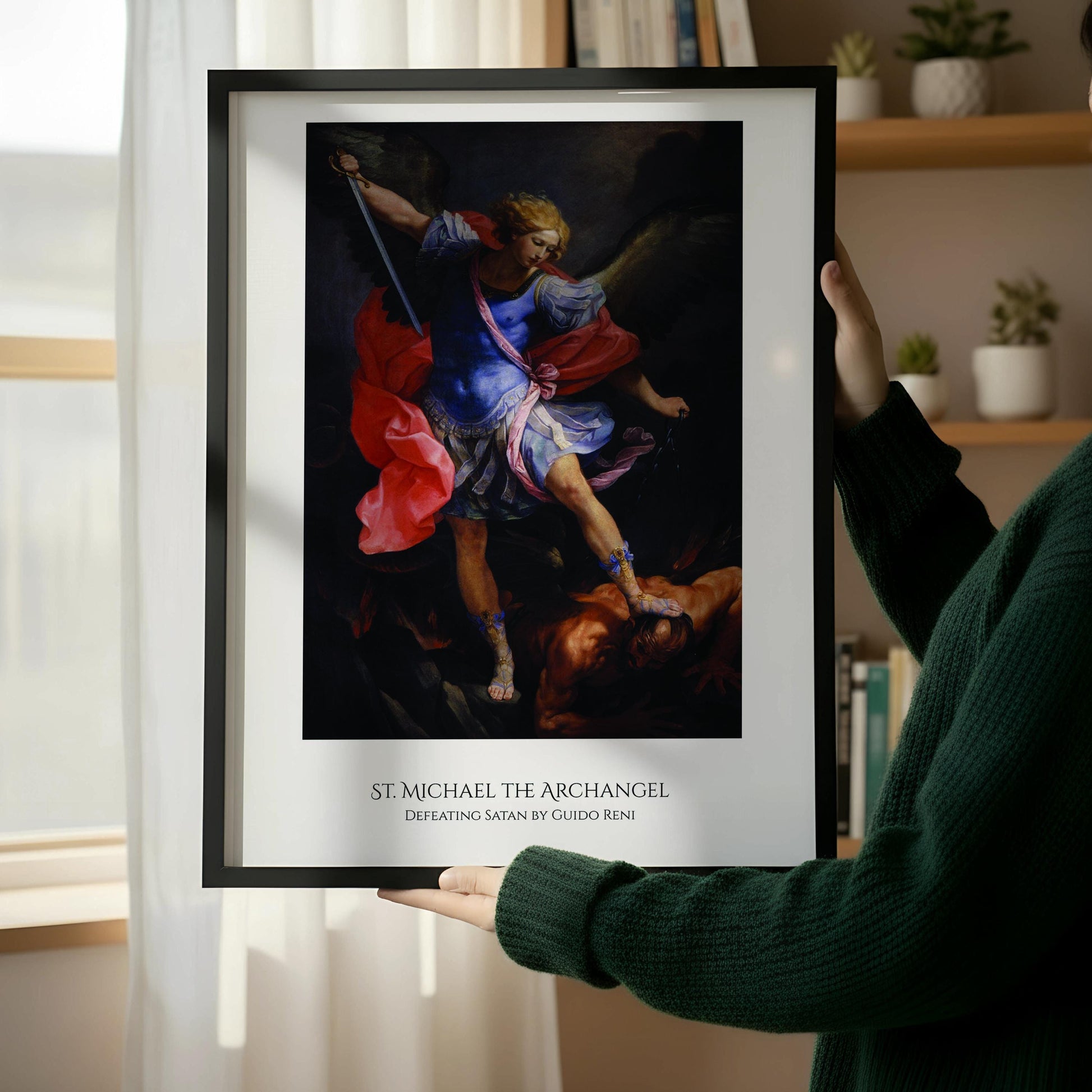 The image is a framed painting depicting the angel St. Michael, who is shown in a dramatic pose with a sword, standing over a fallen figure.