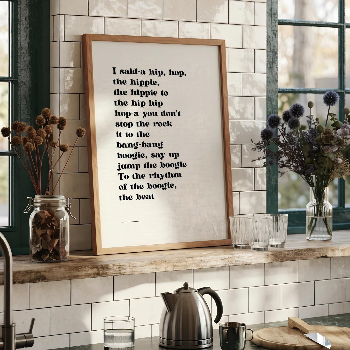 a framed quote with a black and white color scheme, placed on a white surface.