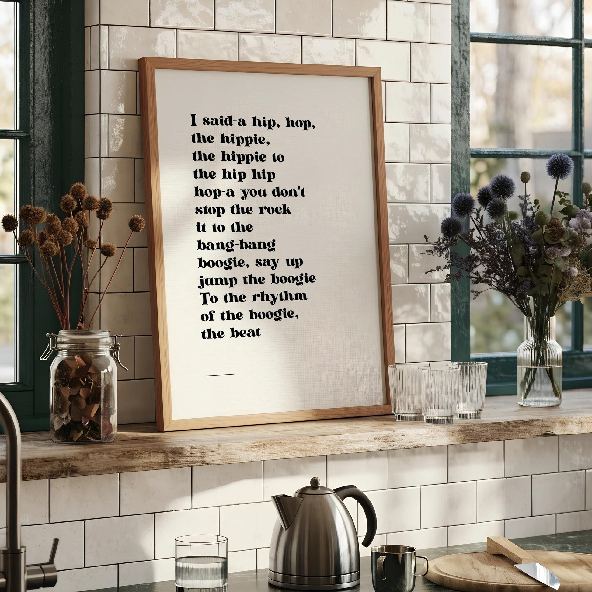 a framed quote with a black and white color scheme, placed on a white surface.
