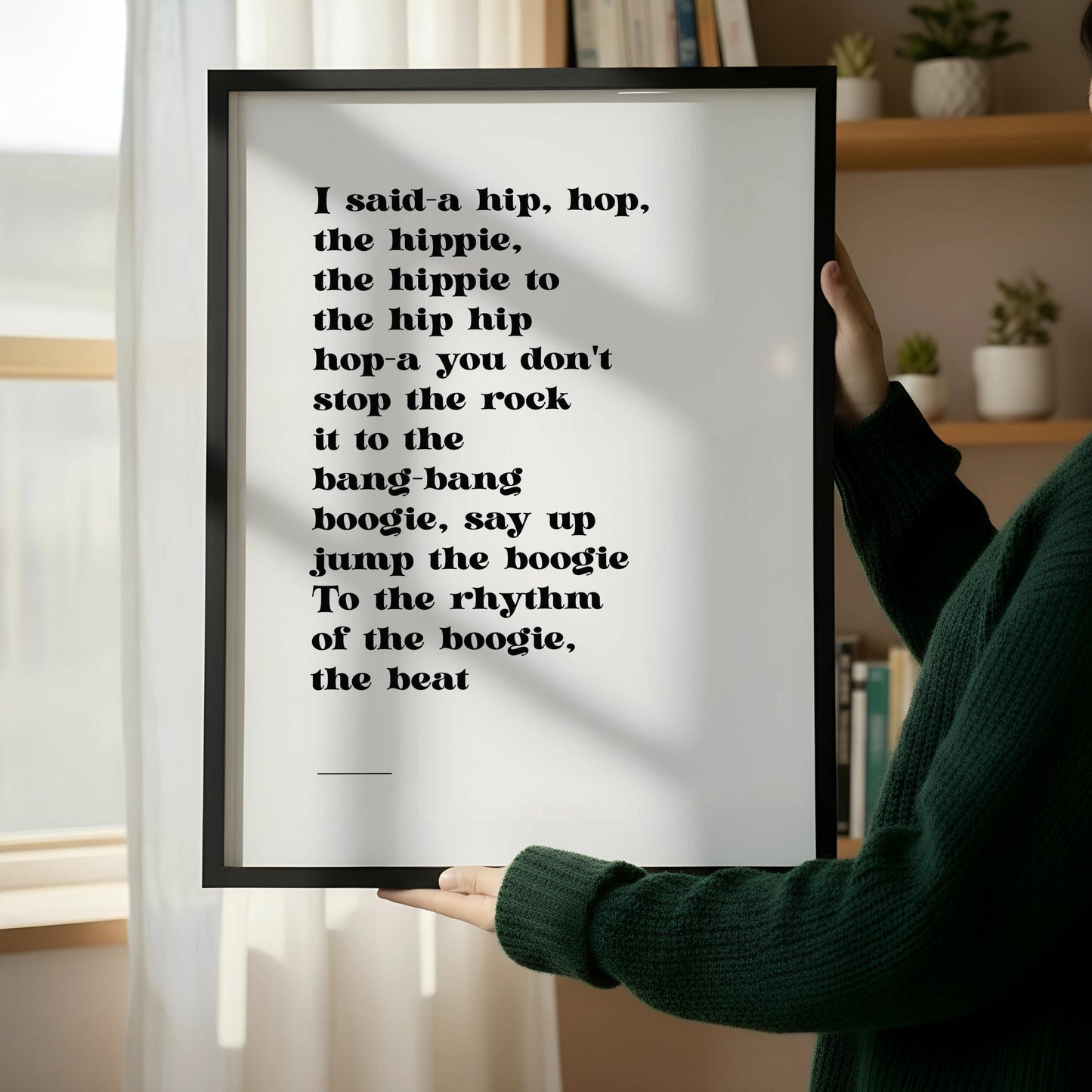a framed quote with a hip-hop-inspired text, hanging on a wall.