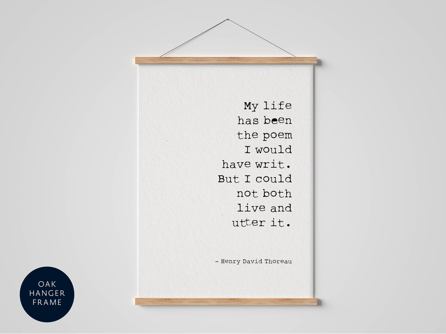 a framed quote by Henry David Thoreau, which reads: "My life has been the poem I would have write. But I could not both live andutter it."