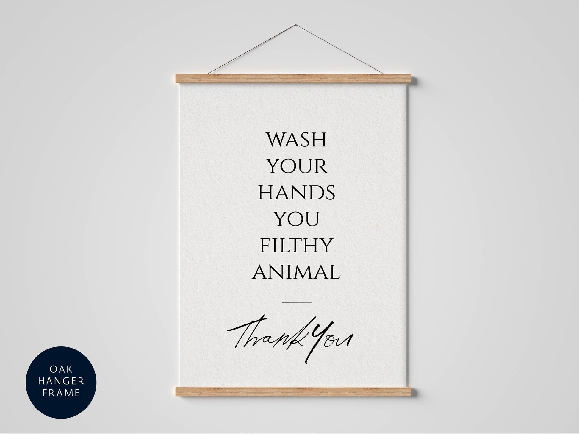 a framed poster with the text "WASH YOUR HANDS YOU FILthy ANIMAL" and a handwritten "Thank You" below it.