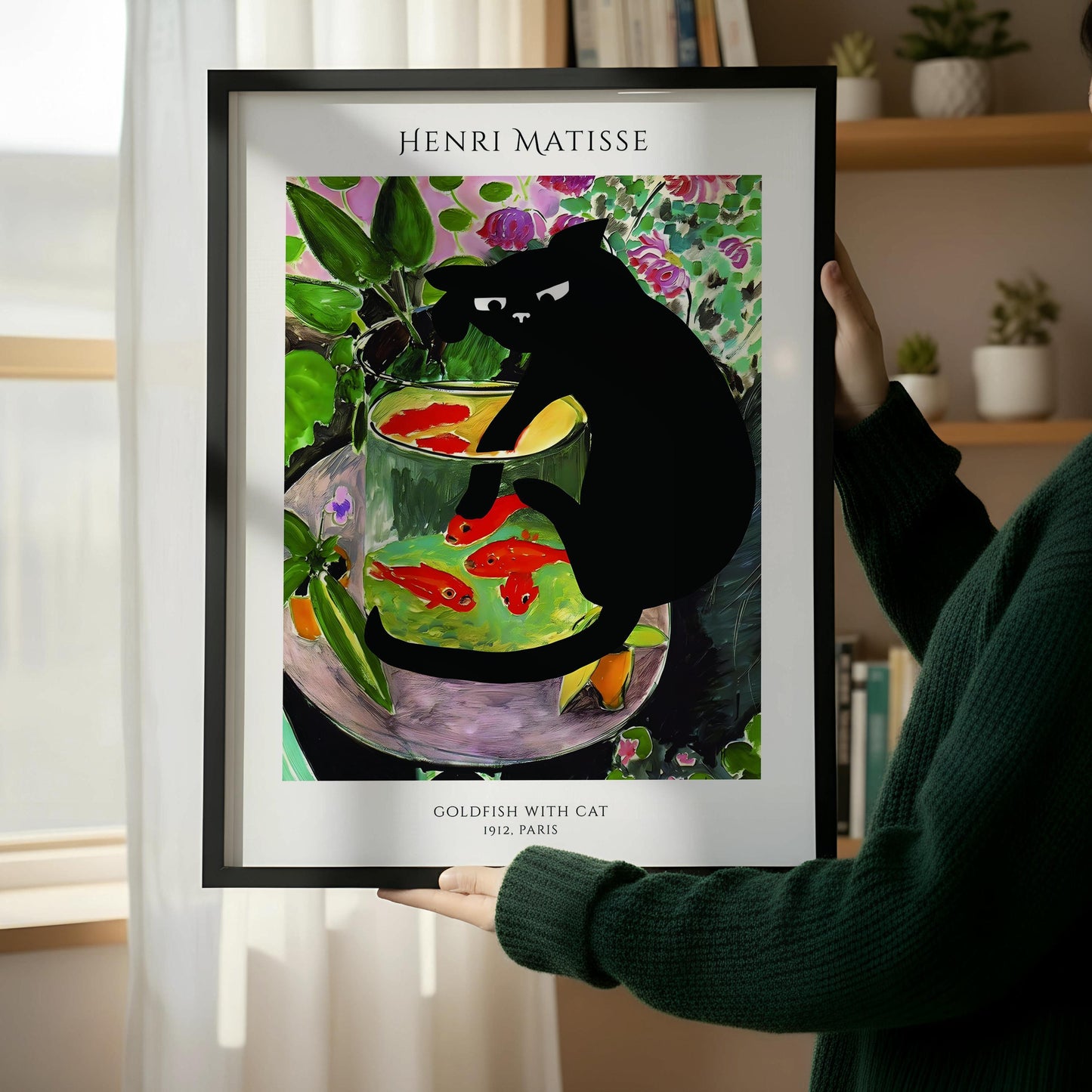 a framed painting of a black cat sitting in a fishbowl, with a wooden chair and a stack of books next to it.