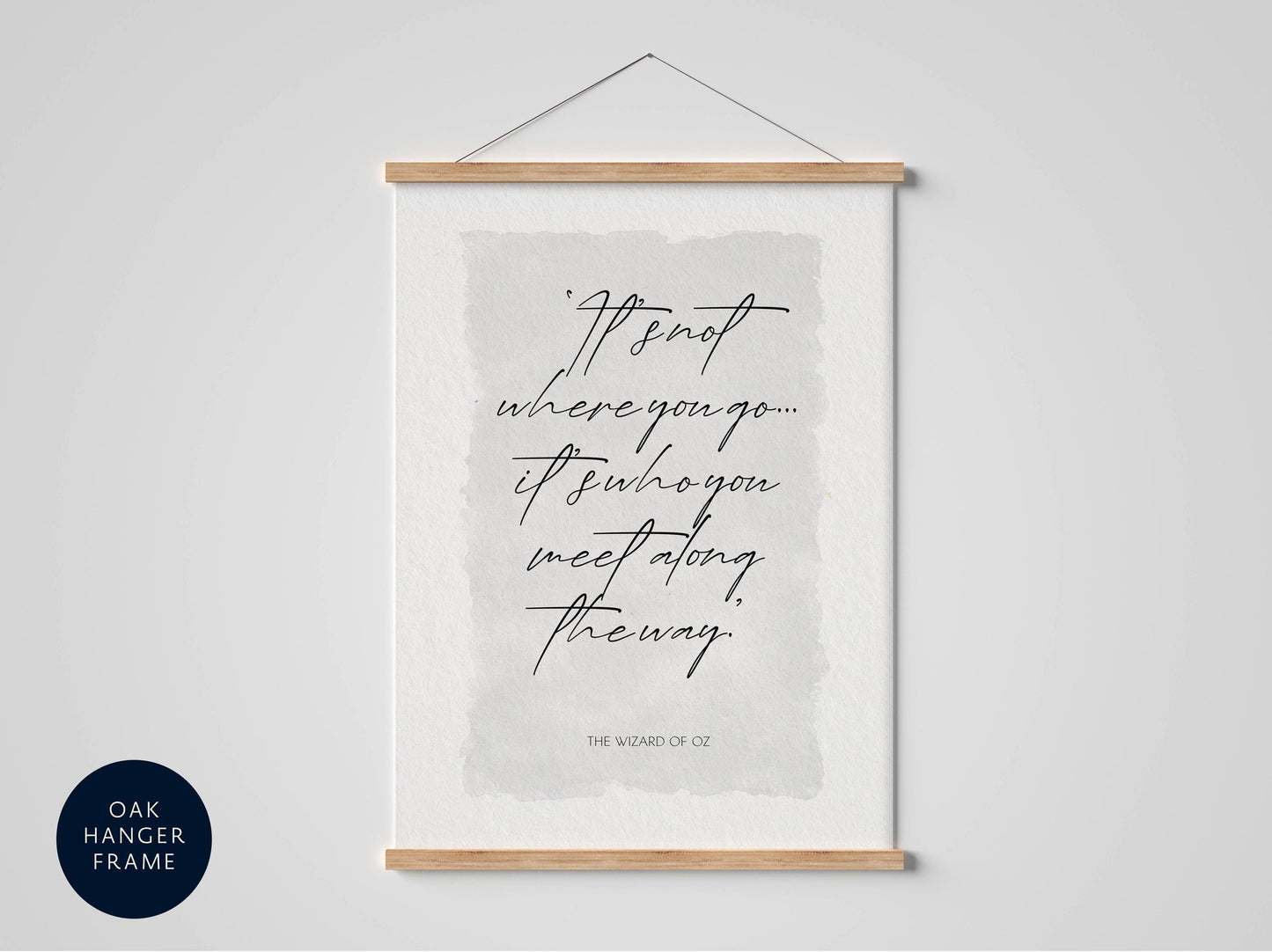 a framed quote that reads "It's not where you go, it's who you meet along the way." The quote is presented in a black cursive font against a light gray background.
