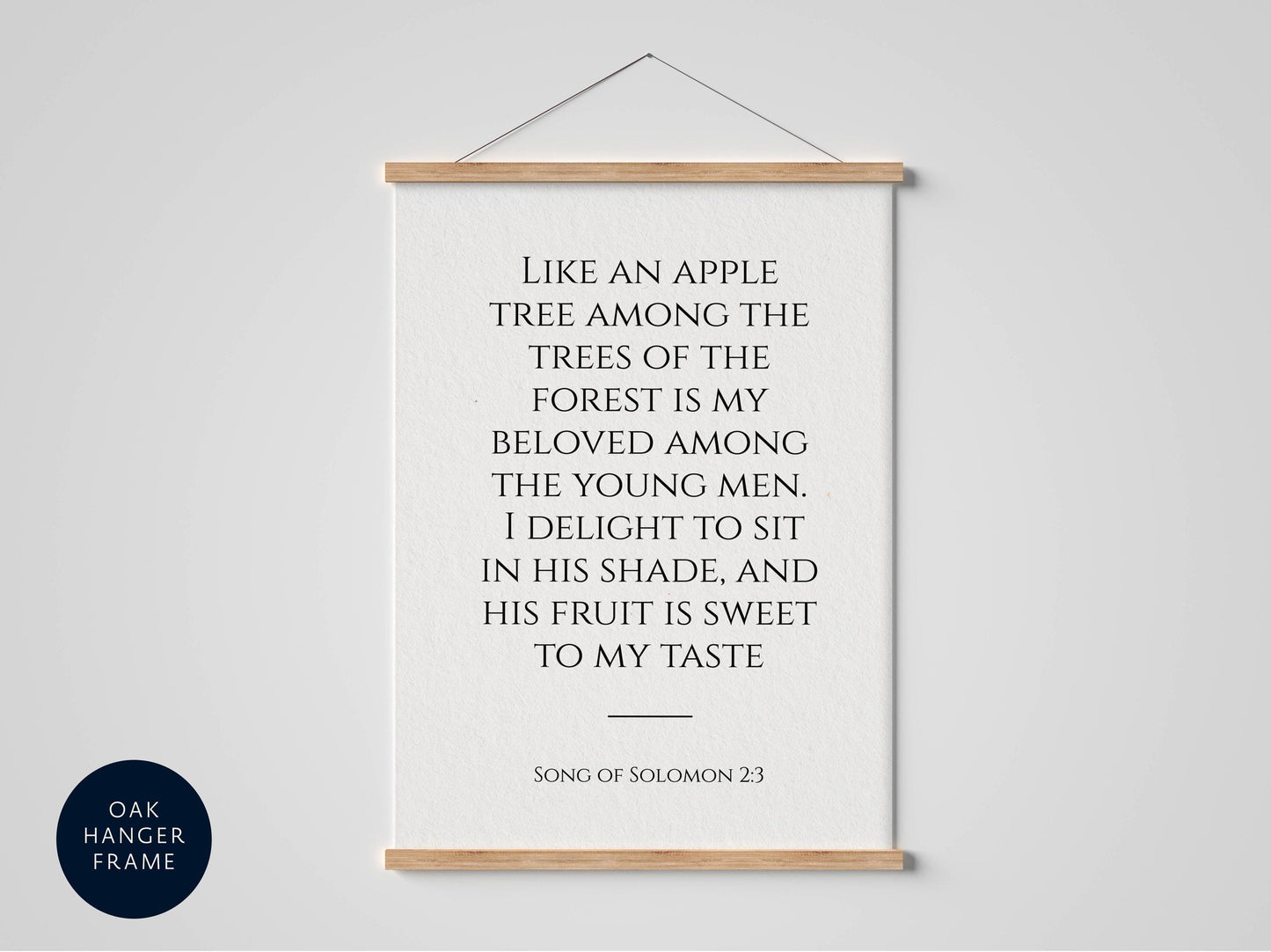 a framed quote from the song of Solomon 23, which reads: "Like an apple tree among the trees of the forest is my beloved among the young men, I delight to sit in his shade, and his fruit is sweet to my taste."
