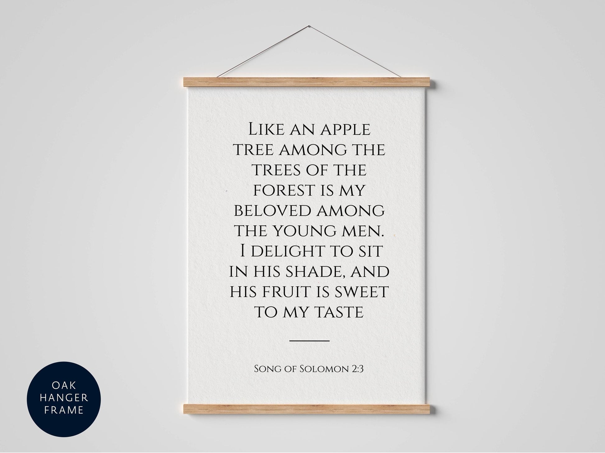 a framed quote from the song of Solomon 23, which reads: "Like an apple tree among the trees of the forest is my beloved among the young men, I delight to sit in his shade, and his fruit is sweet to my taste."