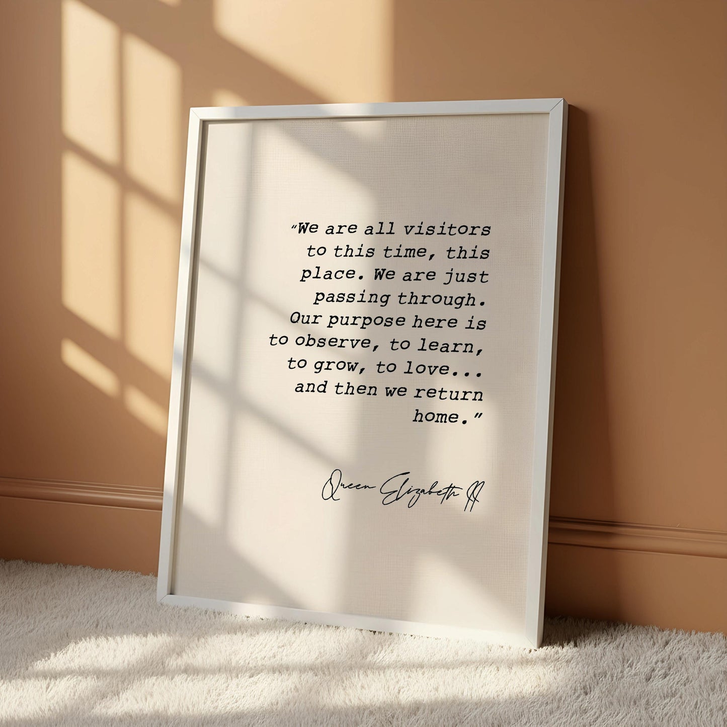 a quote by Queen Elizabeth II hanging on a wall.