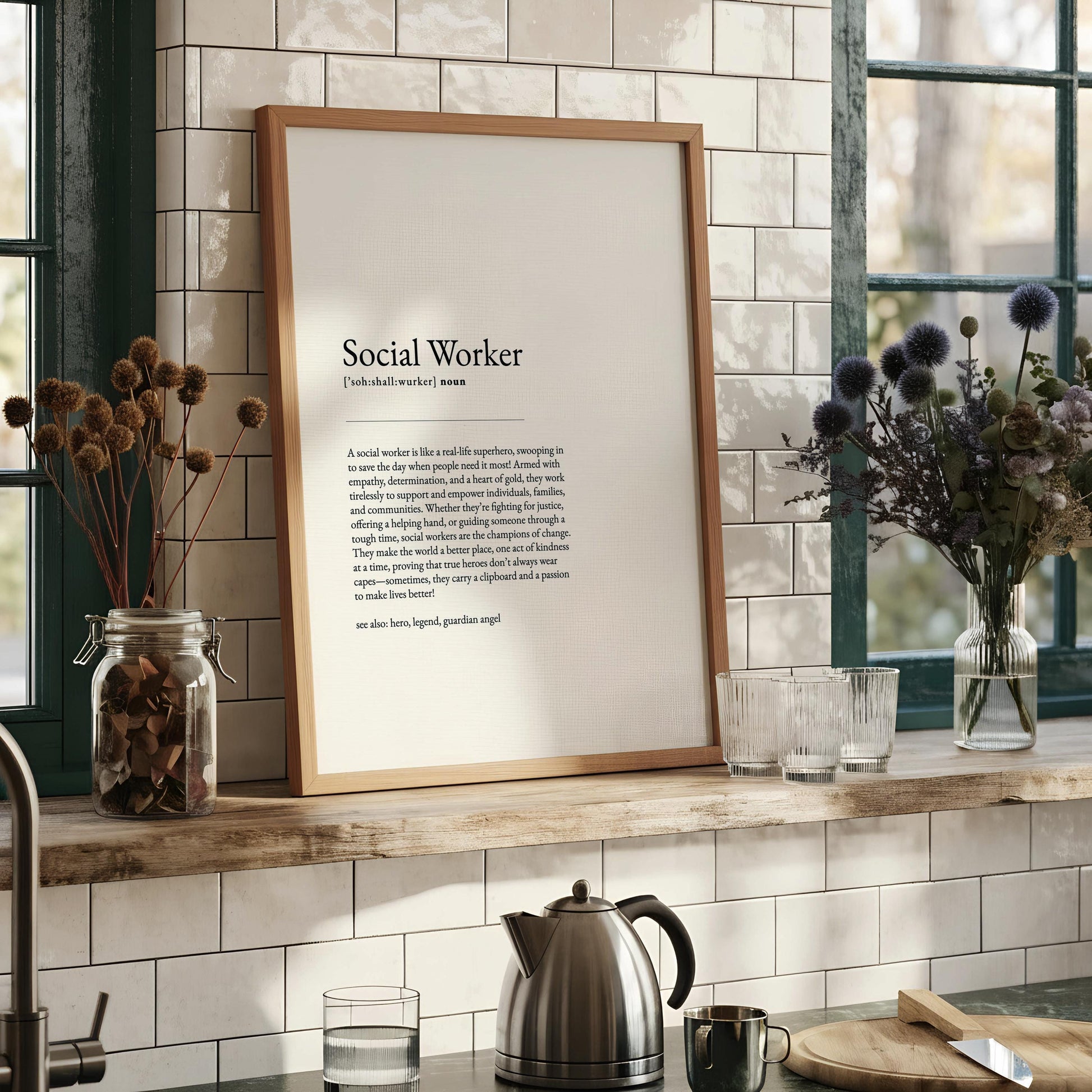a black framed print with a definition of a social worker, which is a real-life superhero, swooping in to save the day when people need help.