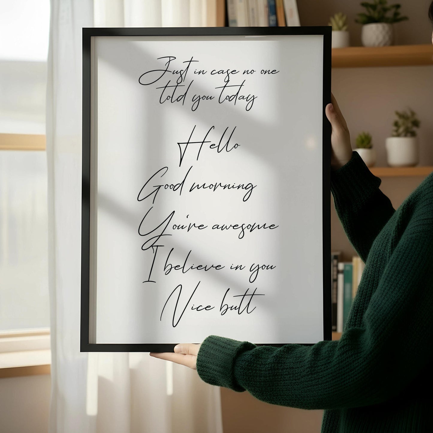 a wooden chair with a framed quote on the wall next to it.