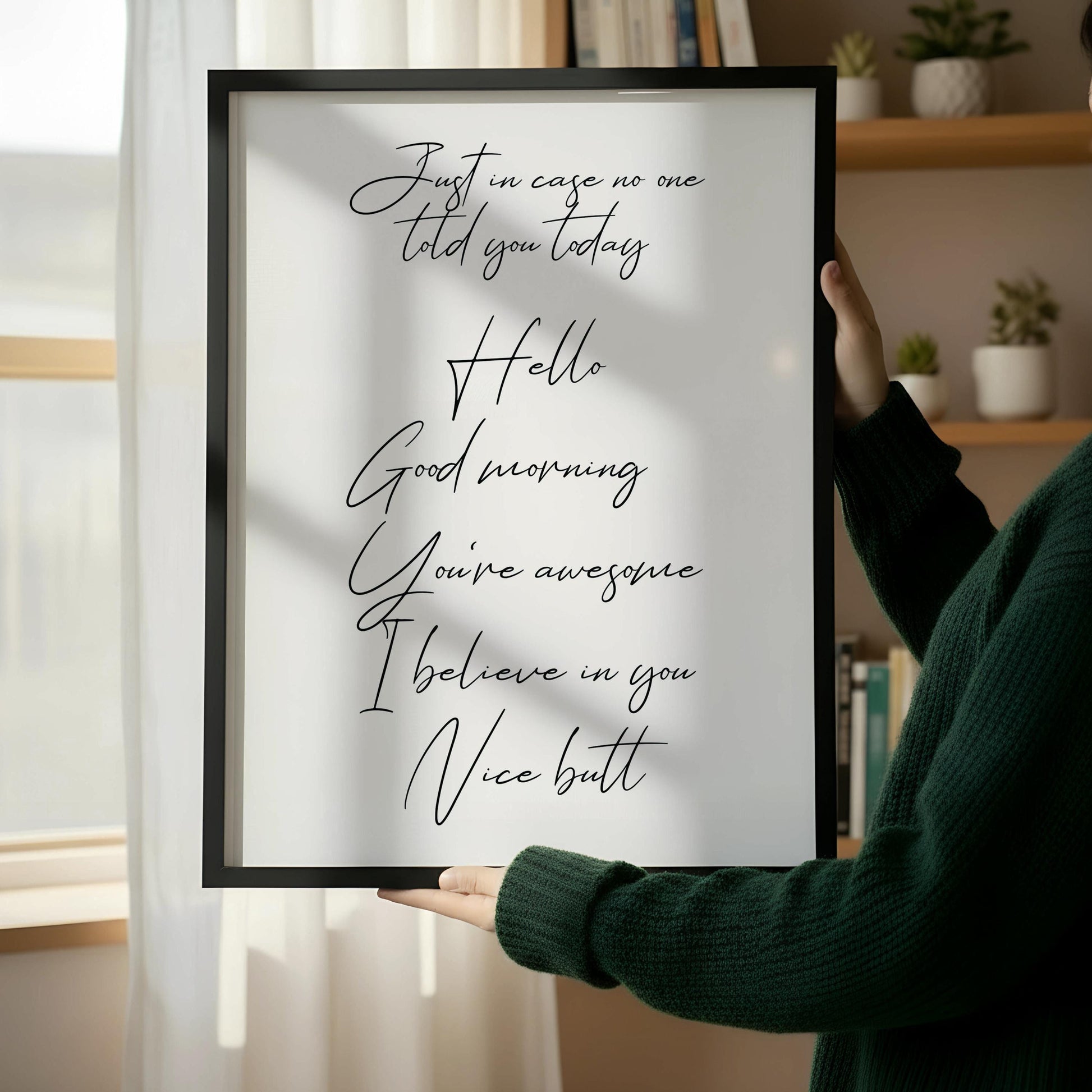 a wooden chair with a framed quote on the wall next to it.