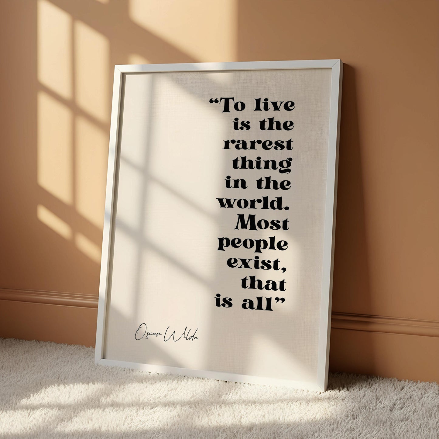 a quote by Oscar Wilde in a black frame, which is the rarest thing in the world.