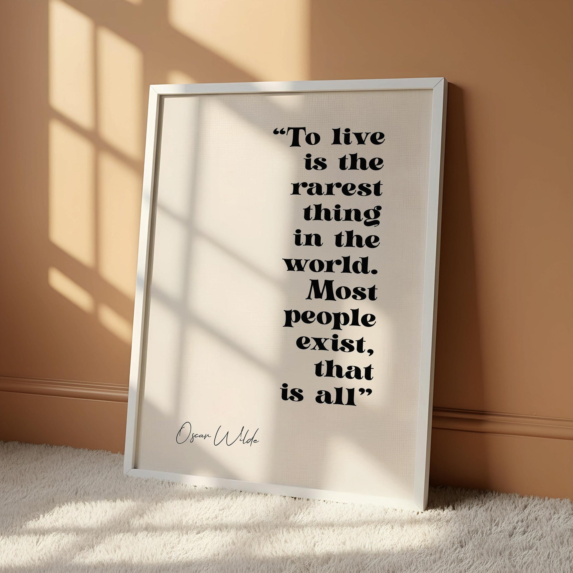 a quote by Oscar Wilde in a black frame, which is the rarest thing in the world.