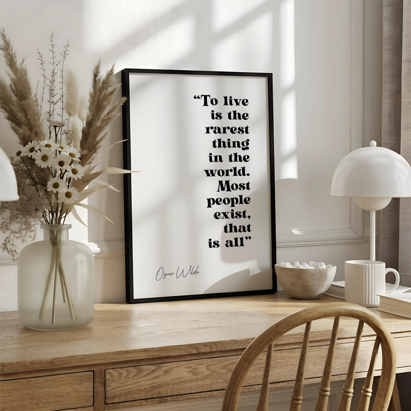 a quote by Oscar Wilde that reads "To live is the rarest thing in the world. Most people exist, that is all."