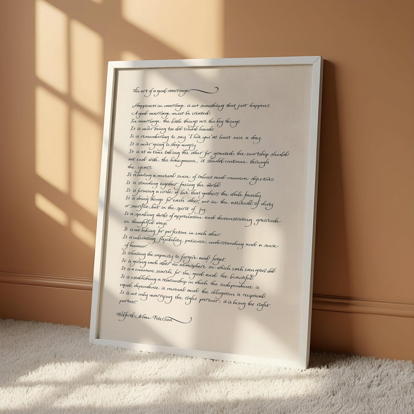 The image is a handwritten text on a white background, which appears to be a quote or a poem. The text is written in cursive and is framed by a wooden border.
