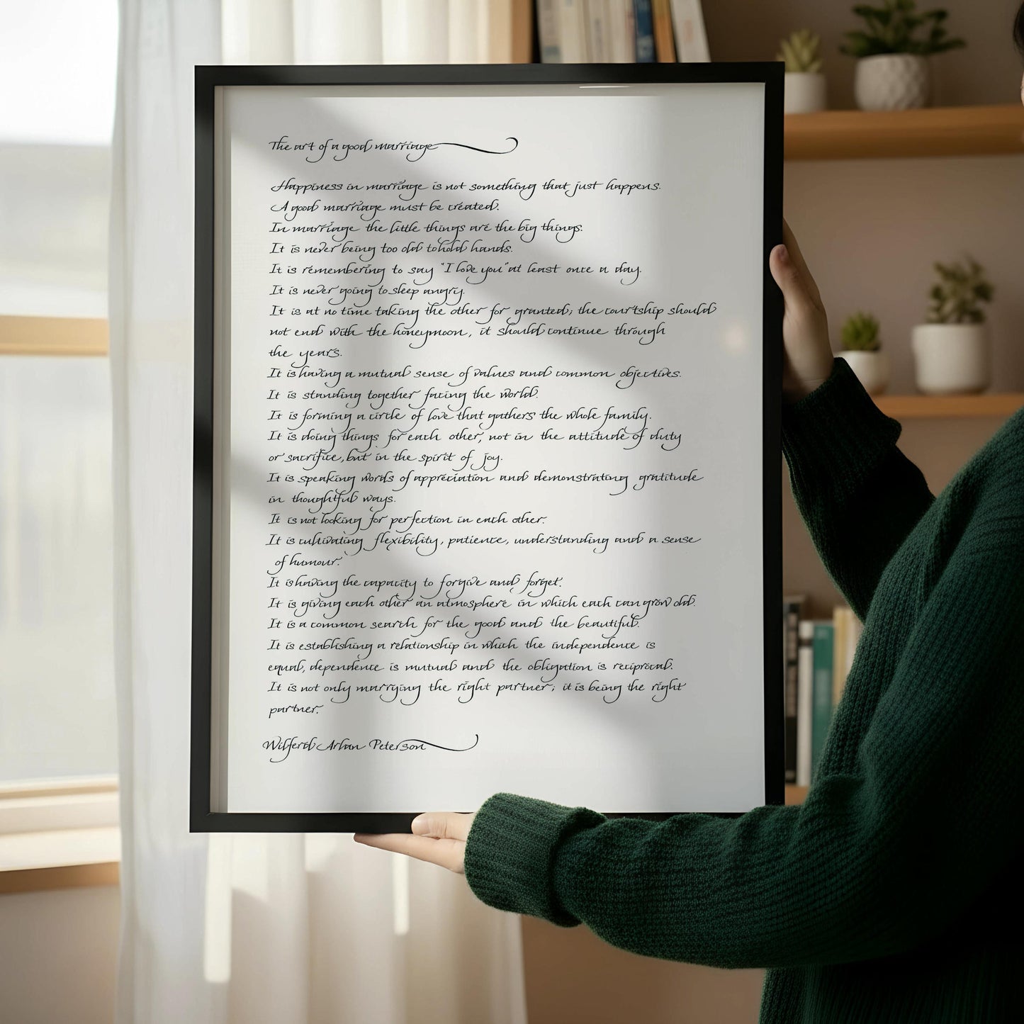 a framed handwritten text that reads "The art of a good marriage" in a cursive script.