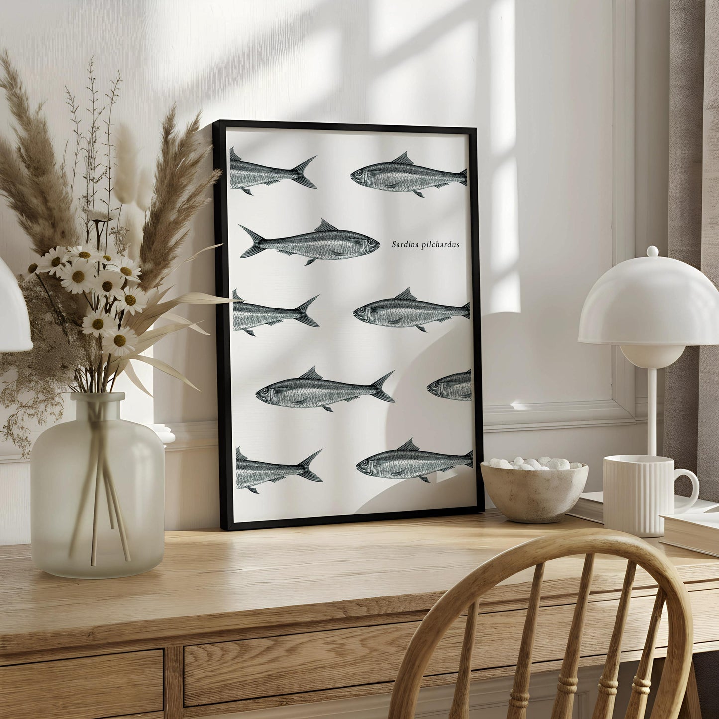 The image is a framed print featuring a repeating pattern of fish illustrations on a white background.