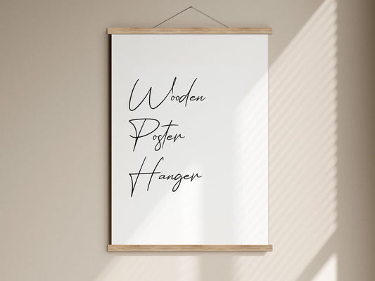 A white poster with the words "Wooden Posters Hangen" written on it, hanging on a wall.