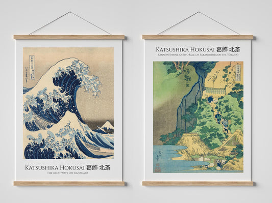two framed prints of the famous Japanese woodblock print "The Great Wave off Kanagawa" by the artist Katsushika Hokusai. The prints feature the iconic wave and the surrounding landscape, showcasing the artist's skill and the beauty of the natural world.