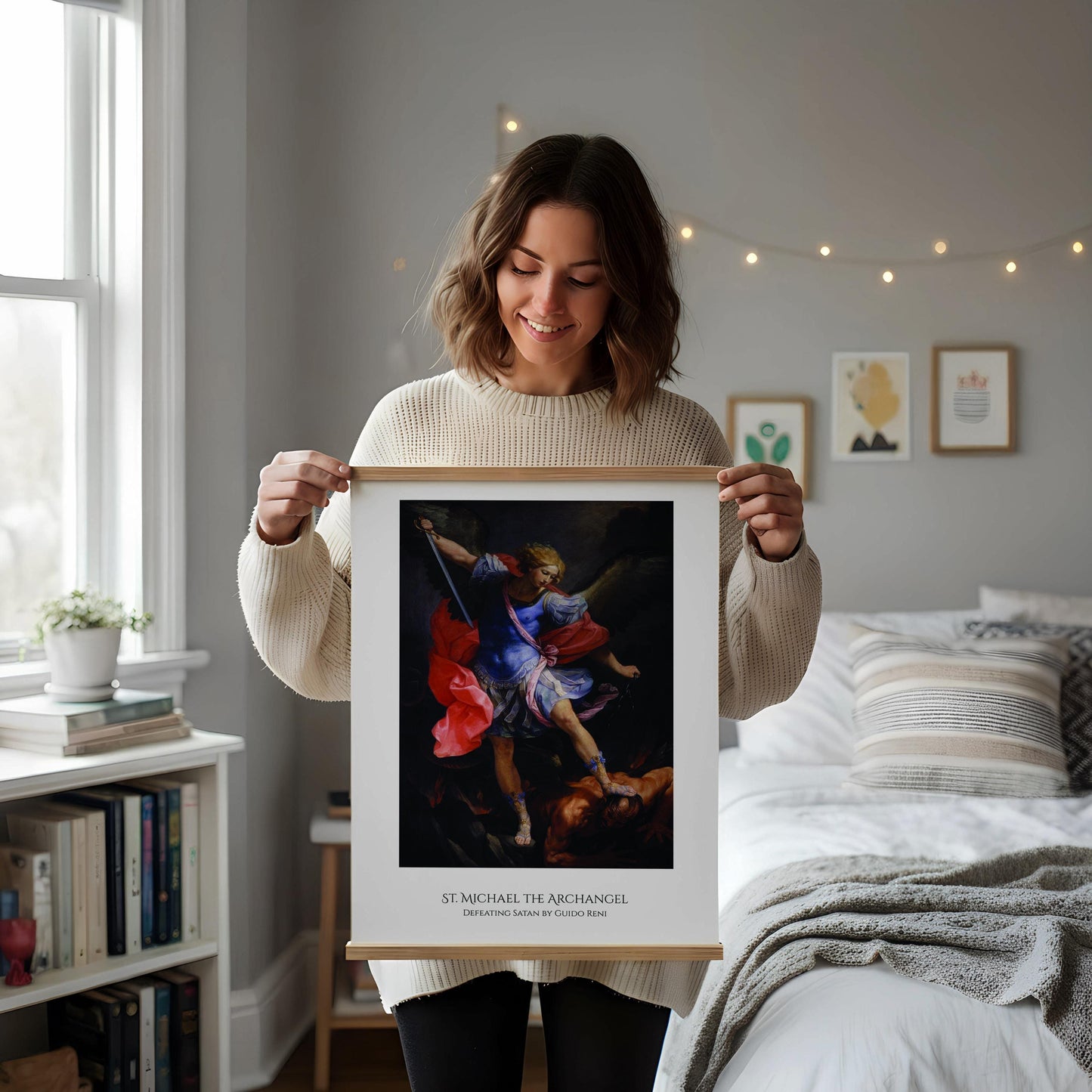 a framed painting of St. Michael the Archangel, a religious figure, standing on a pedestal and holding a sword. The painting is displayed on a wooden floor next to a wooden chair.