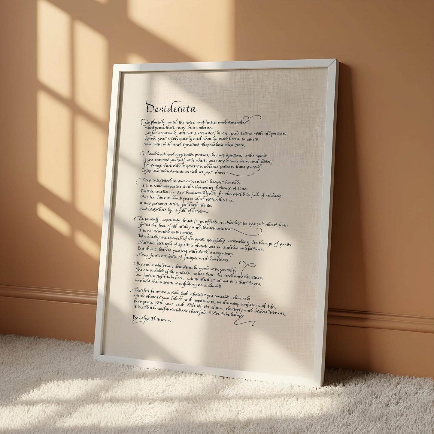 a handwritten poem on a white scroll, which is mounted on a wall.