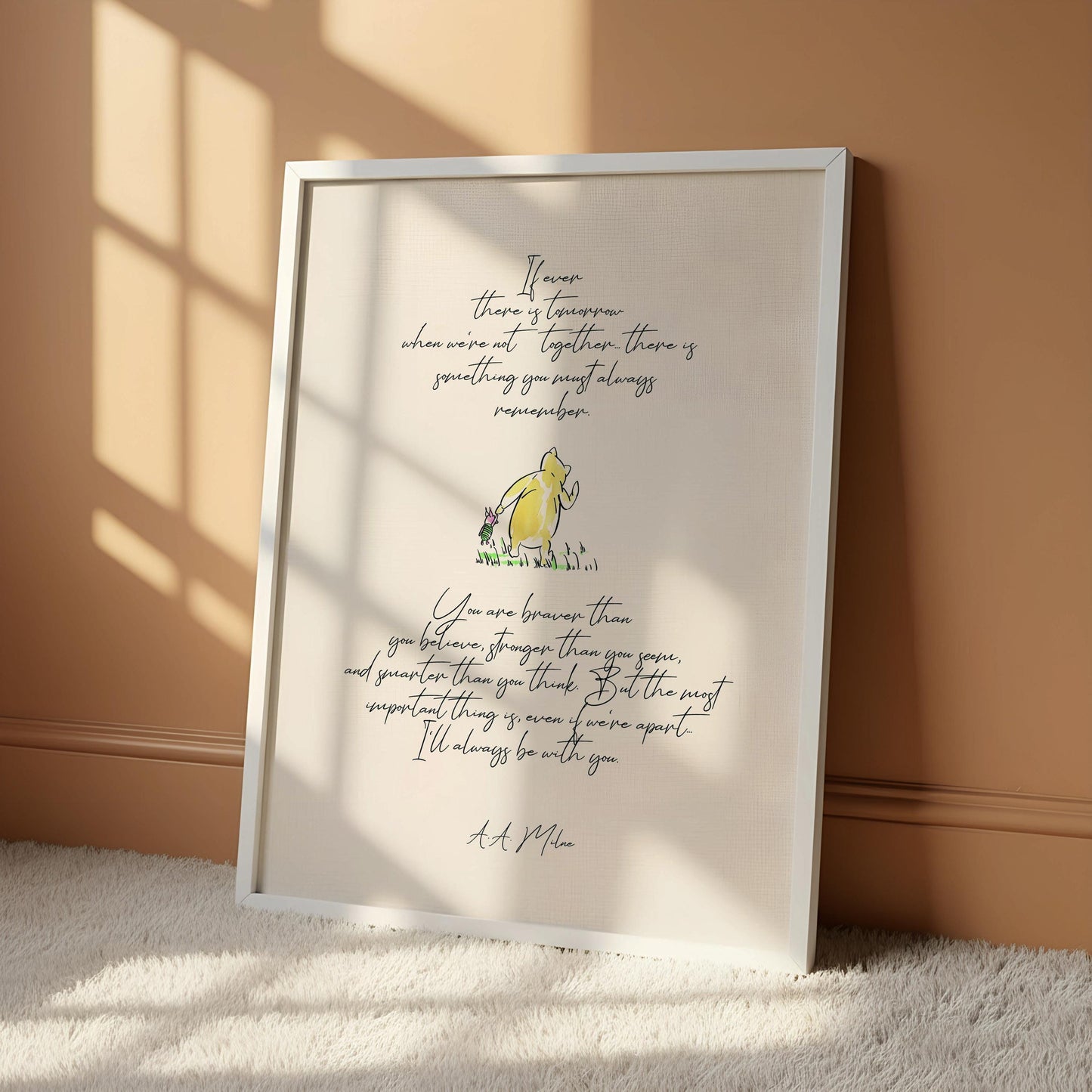 The image is a framed print featuring a quote from the classic children's book " Winnie the Pooh" by A. A. Milne. The quote is written in a cursive font and is accompanied by an illustration of the beloved character, Winnie the Pooh. The quote is displayed on a white background, and the frame is hanging on a wall.