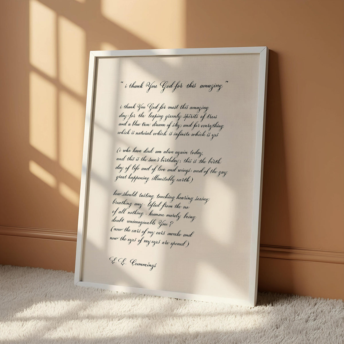 a framed print with a handwritten message on it, hanging on a wall.