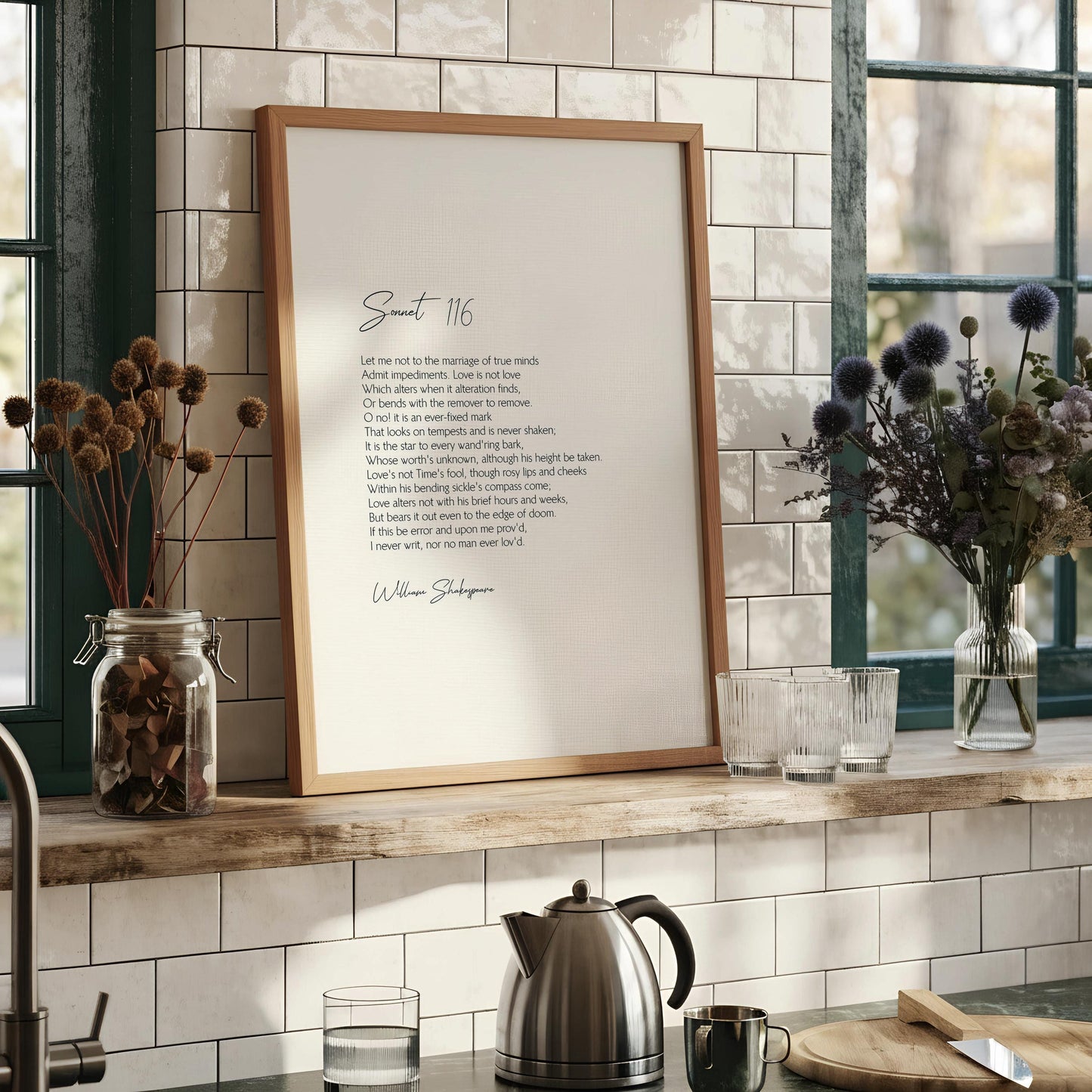 a framed print of a poem titled "Soutt 116" by William Shakespeare, with a black and white color scheme.