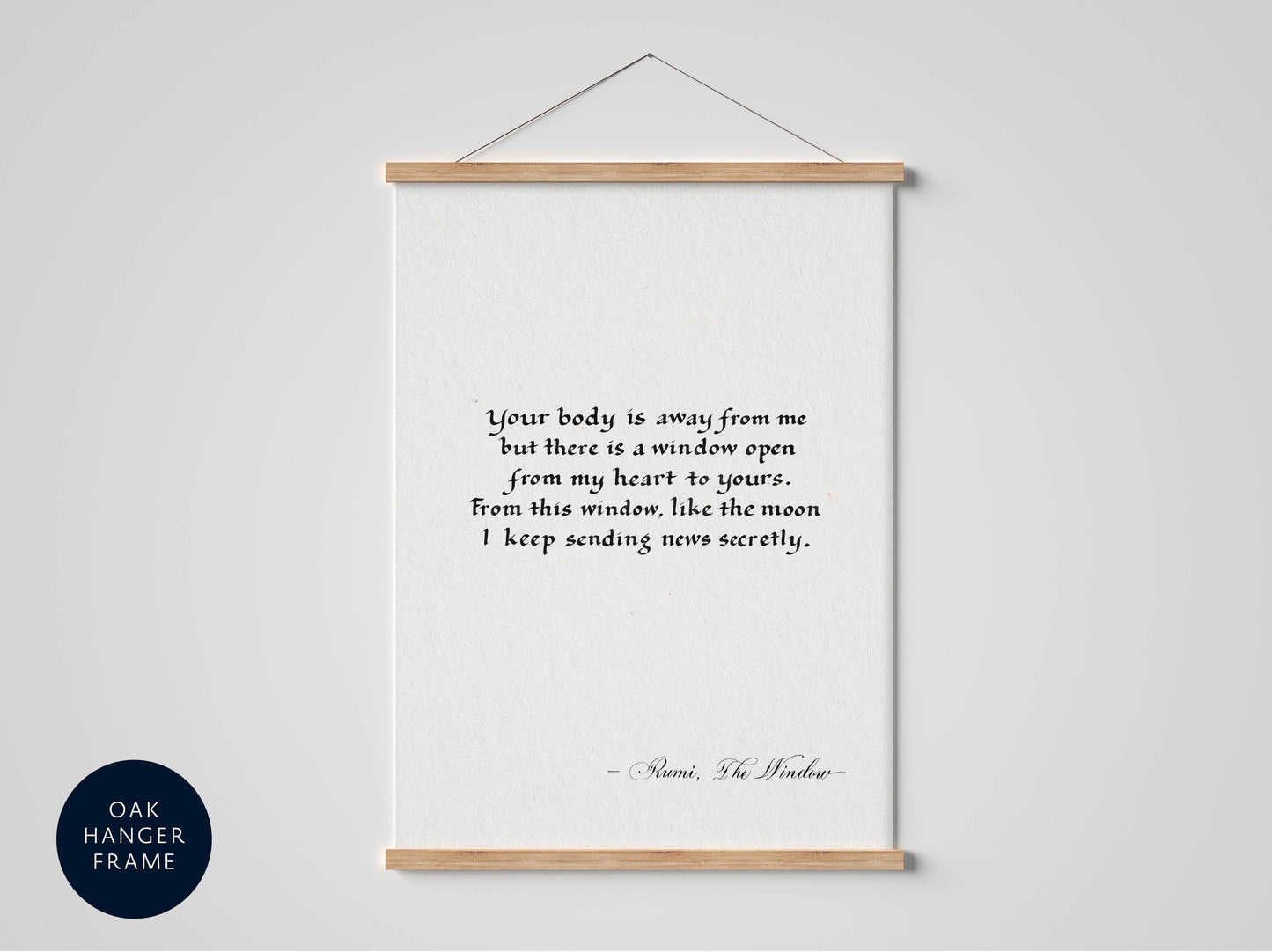 a framed quote by Rumi, the poet, which reads: "Your body is away from me, but there is a window open from my heart to yours. From this window, like the moon I keep sending news securely."