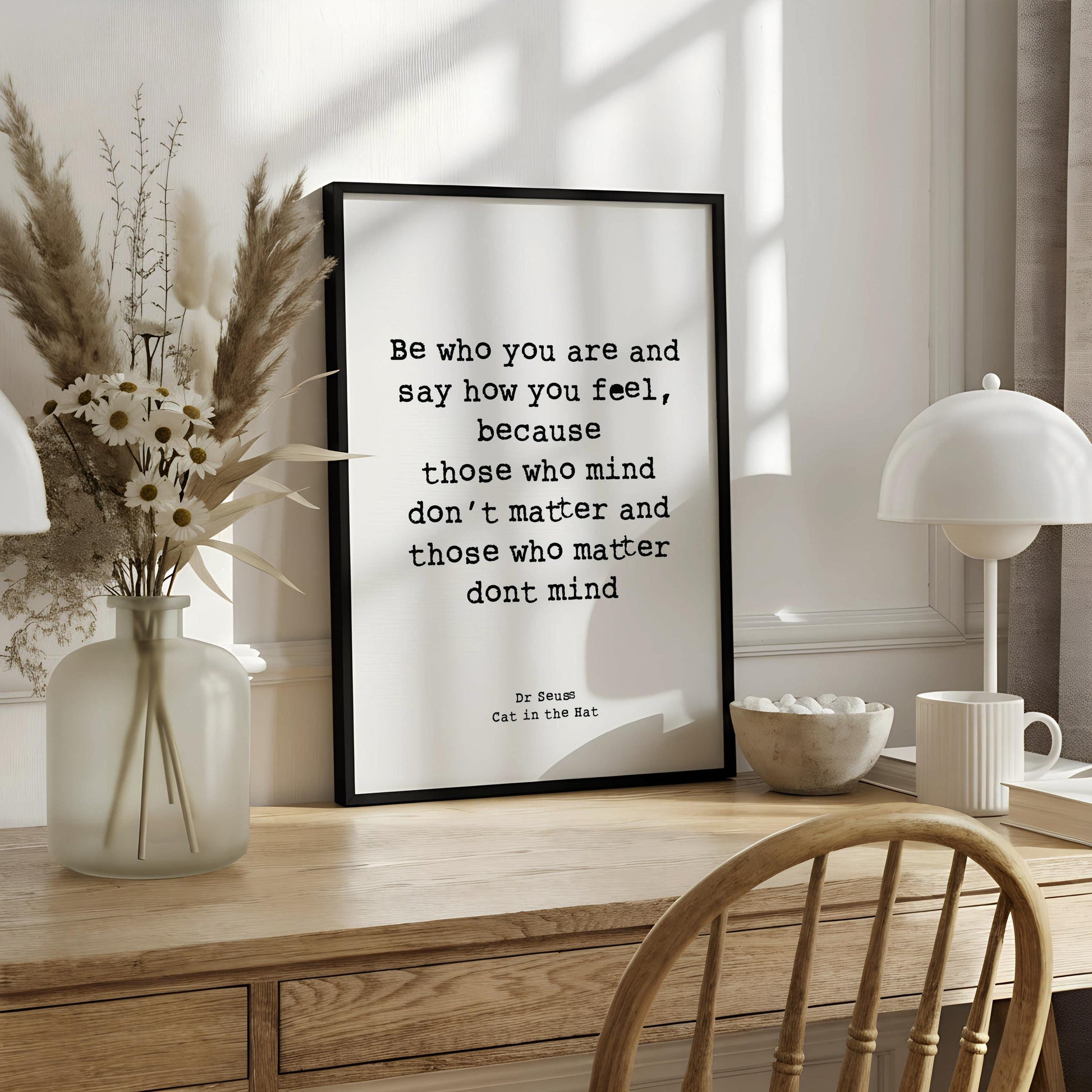 a quote from the book "Cat in the Hat" by Dr. Seuss, which reads: "Be who you are and say how you feel, because those who mind don't matter and those who matter don't mind."