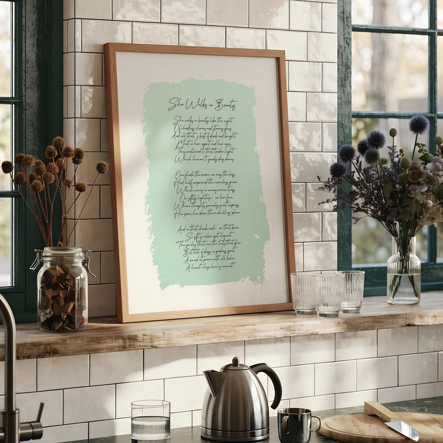 a framed print with a poem or lyrics on it, hanging on a wall.