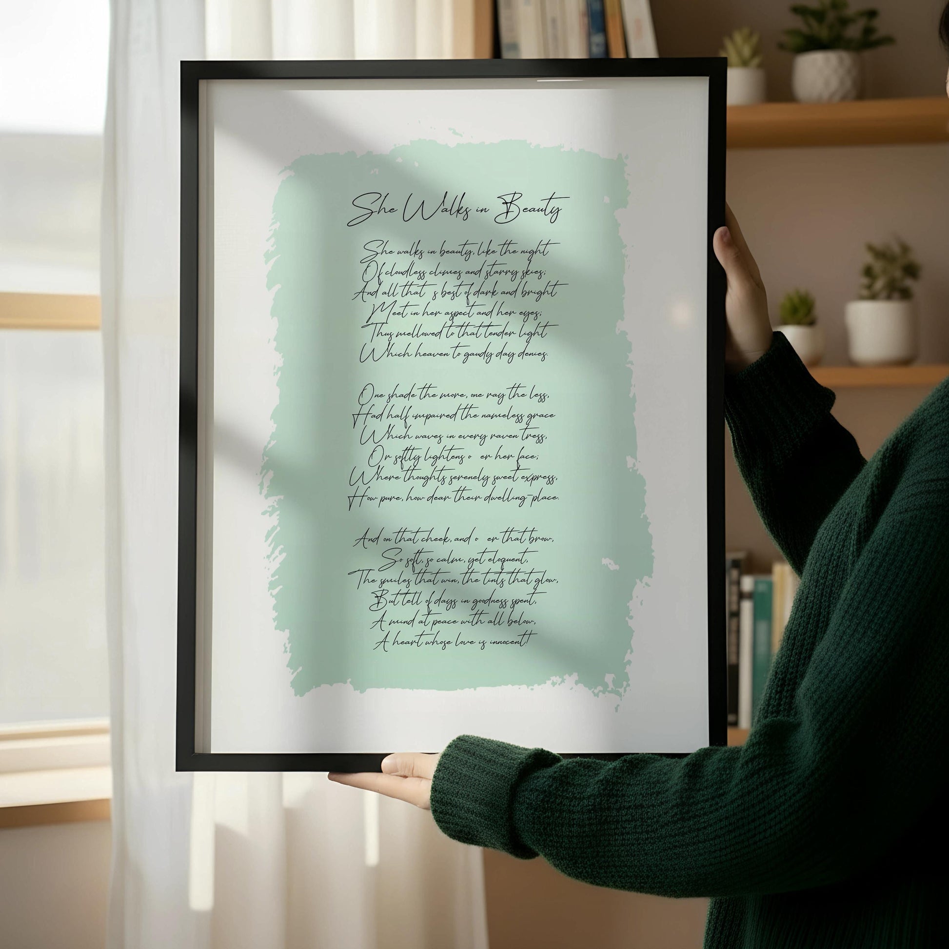 a framed print of a poem leaning against a wall, with a wooden chair and a stack of books placed next to it on a wooden floor.