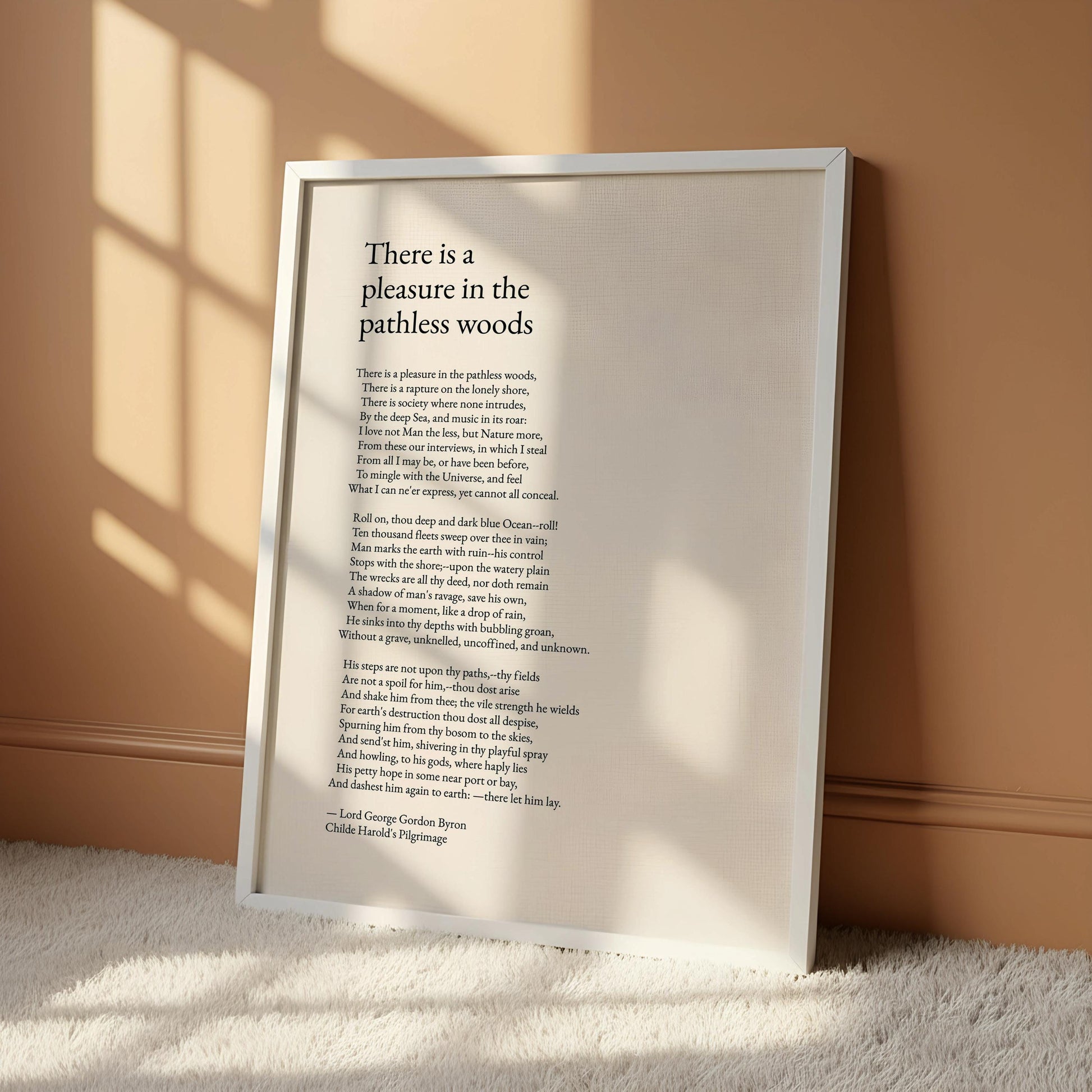 a framed poem titled "There is a pleasure in the pathless woods" by Child Harold, with the poem text displayed in black on a white background.