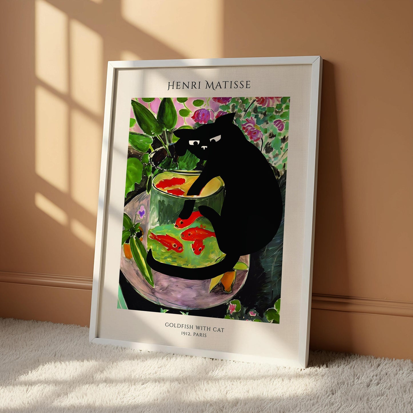 The image is a framed print of the painting "Goldfish with Cat" by Henri Matisse, which depicts a black cat sitting in a glass bowl filled with goldfish.
