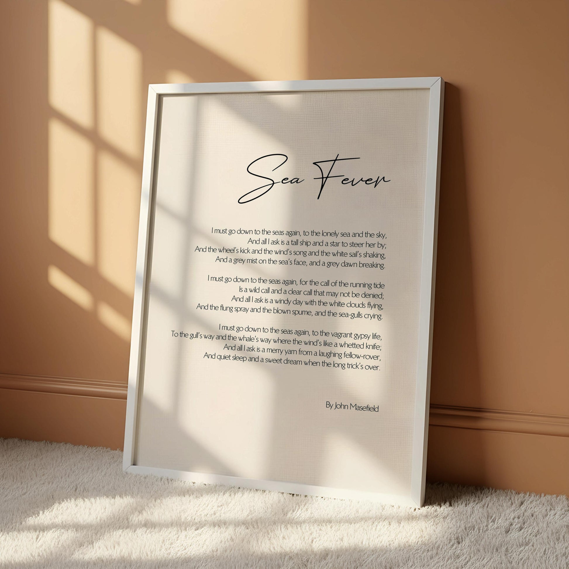 a framed poem titled "Sea Fever" by John Mosedley, which is hung on a wall.