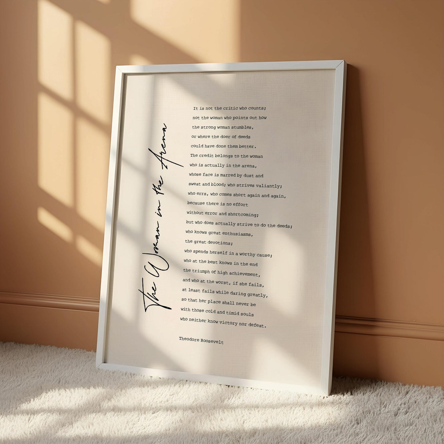 a framed text that reads "The woman in the arena" by Theodore Rosseff.
