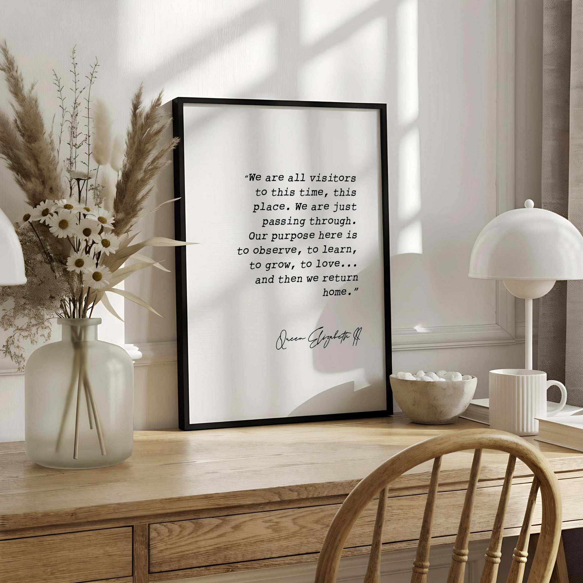 a quote by Queen Elizabeth II hanging on a wall.
