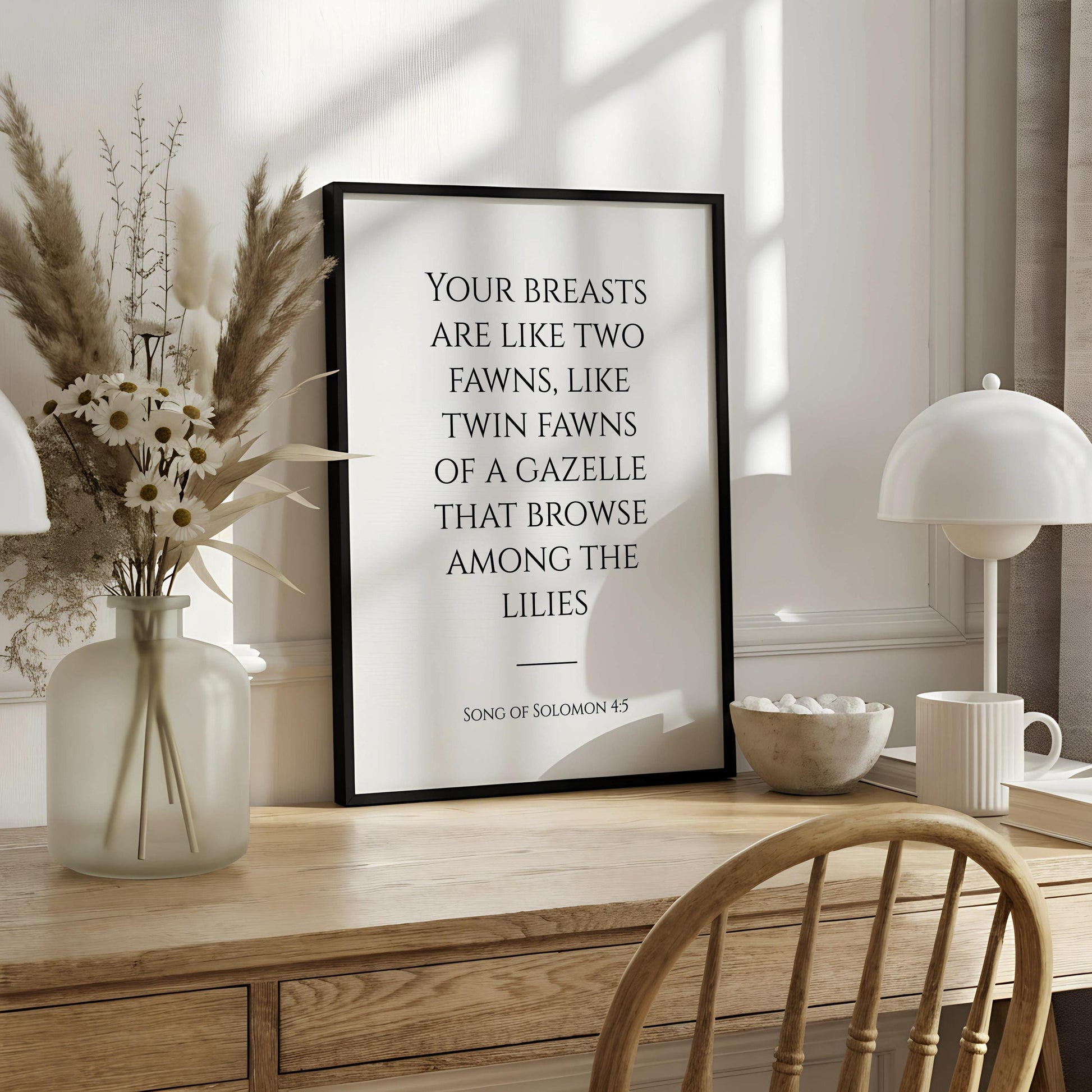 a quote from the song of Solomon 4:5, which reads "Your breasts are like two fawns, like twin fawns of a gazelle that browse among the lilies".