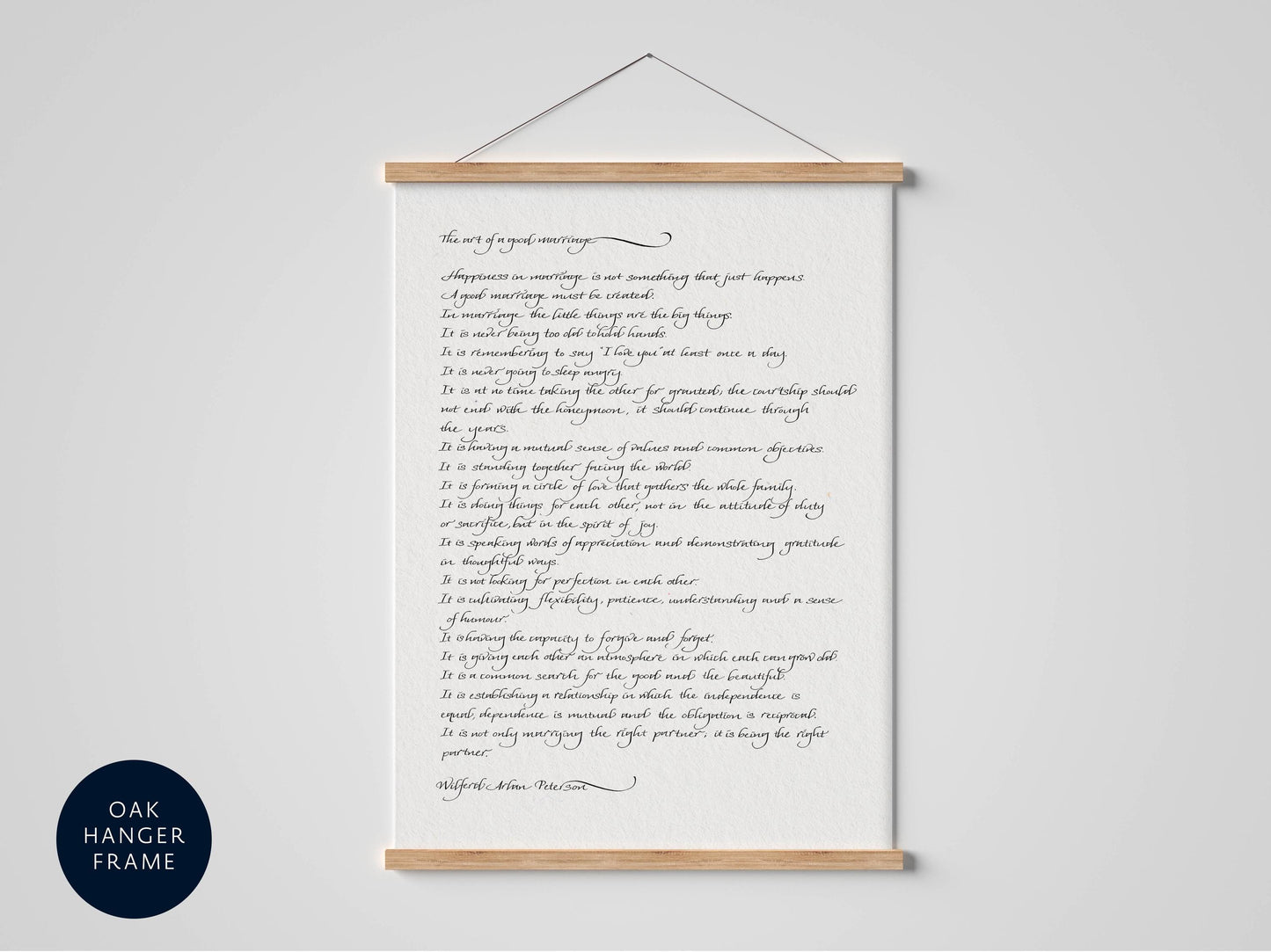a framed handwritten text that reads "The art of good living" in a cursive script.