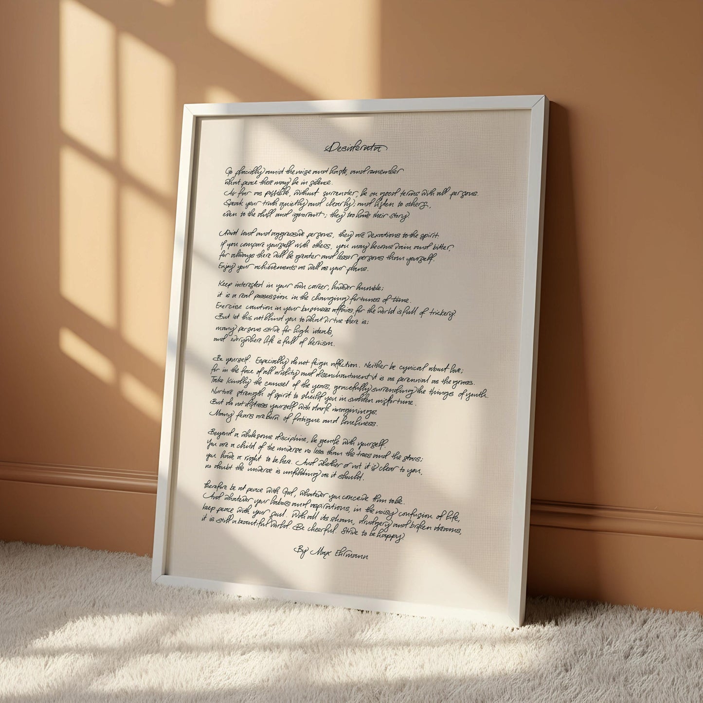 a framed handwritten poem titled "Desertion" hanging on a wall.