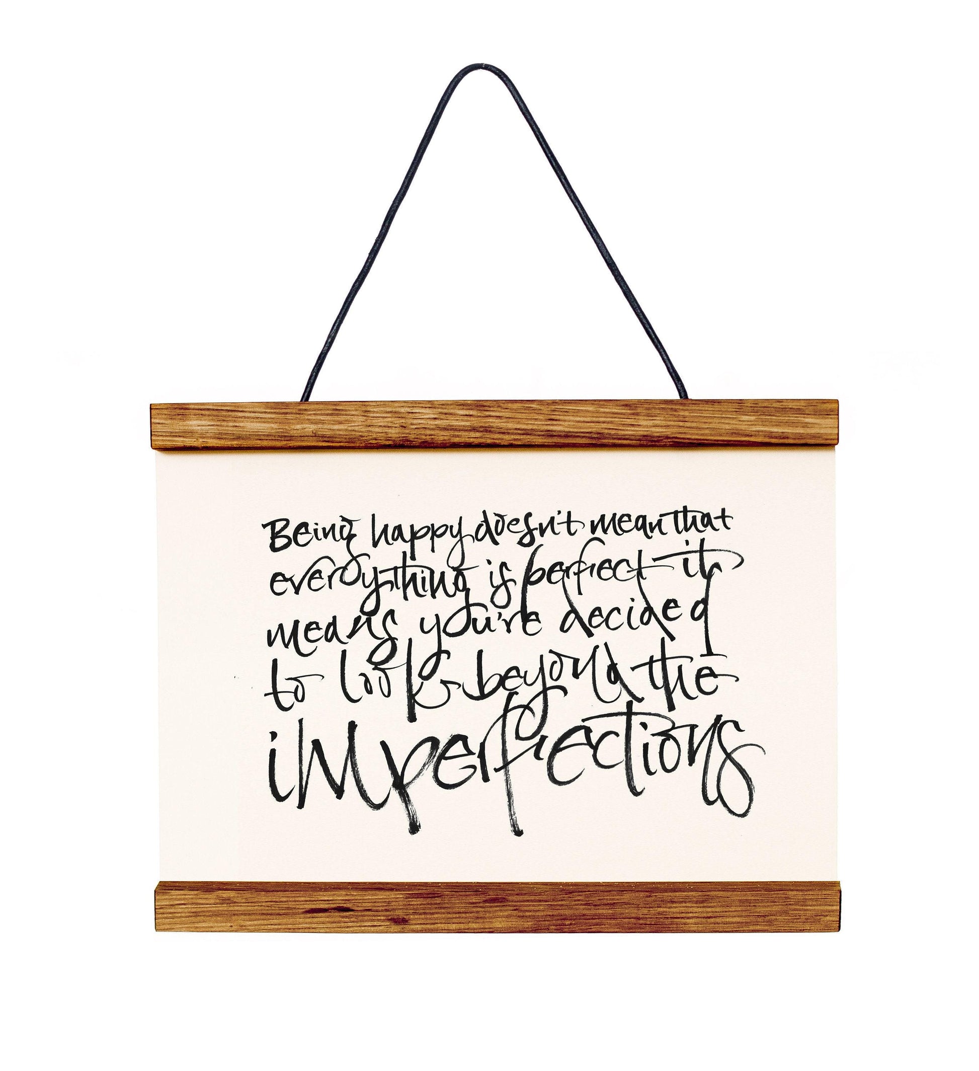 a wooden frame with a white canvas hanging from it, displaying a hand-written message in black ink.