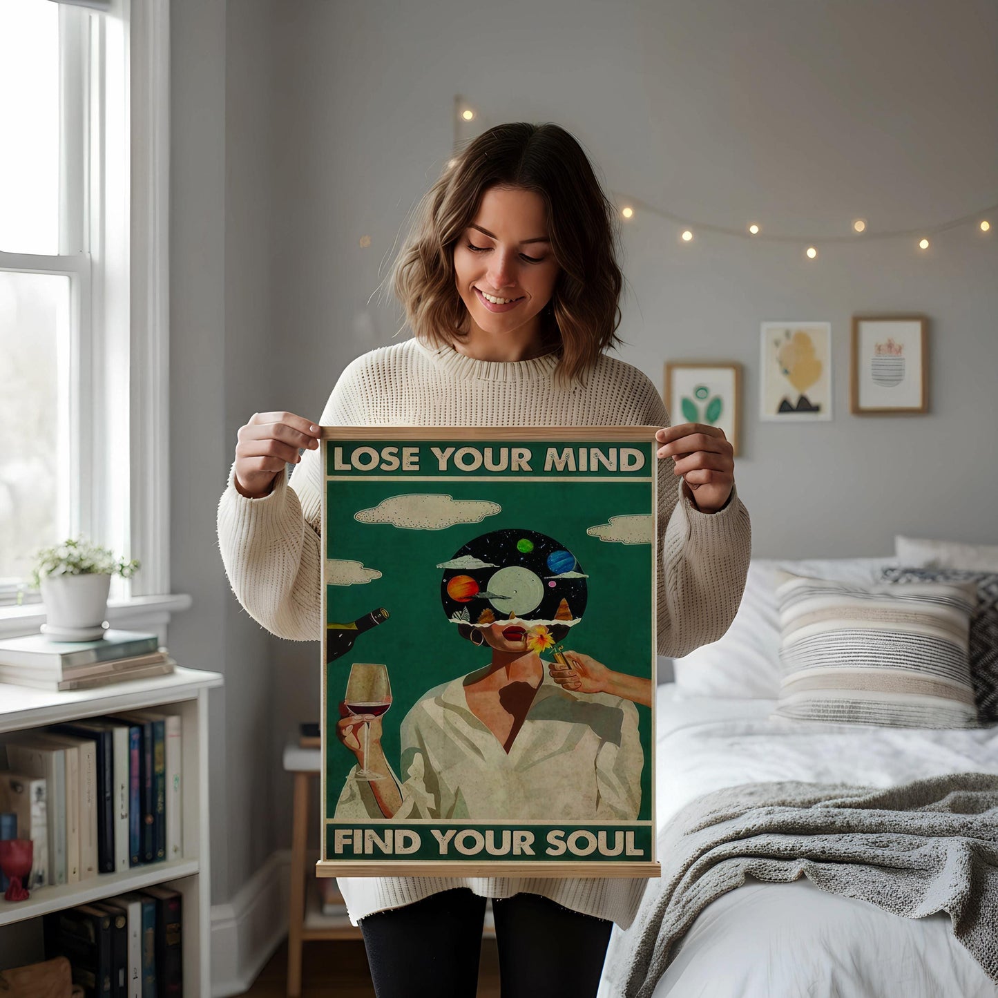 a framed poster with the text "LOSE YOUR MIND FIND YOUR SOUL" displayed on a white wall above a desk with various items on it, including a notebook, a cup, and a vase.