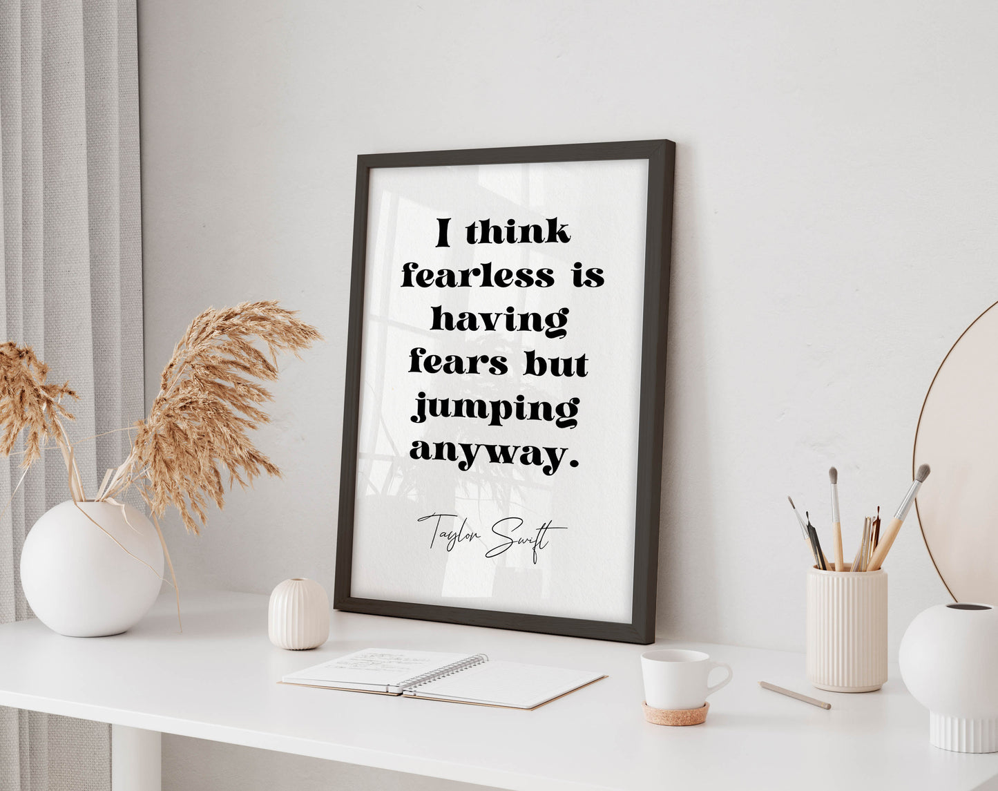Taylor Swift quote - I think fearless is having fears but jumping anyway framed print