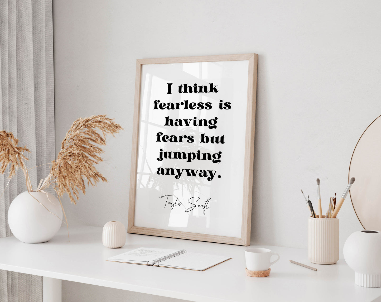 Taylor Swift quote - I think fearless is having fears but jumping anyway framed print